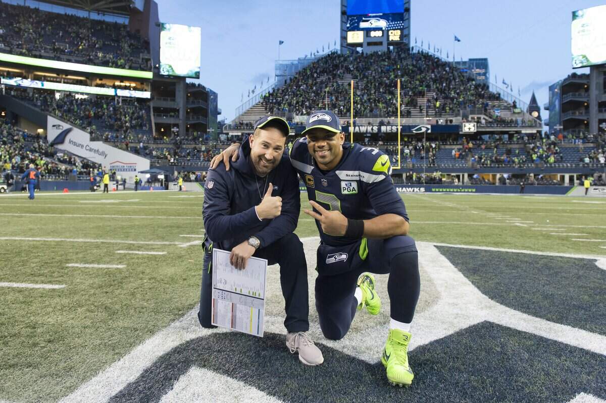 Dec 30, 2018; Seattle, WA, USA; Seattle Seahawks offensive coordinator Brian Schottenheimer and Seattle Seahawks quarterback Russell Wilson (3) pose for a photo after the game against the Arizona Cardinals at CenturyLink Field. Seattle defeated Arizona 27-24. Mandatory Credit: Steven Bisig-USA TODAY Sports