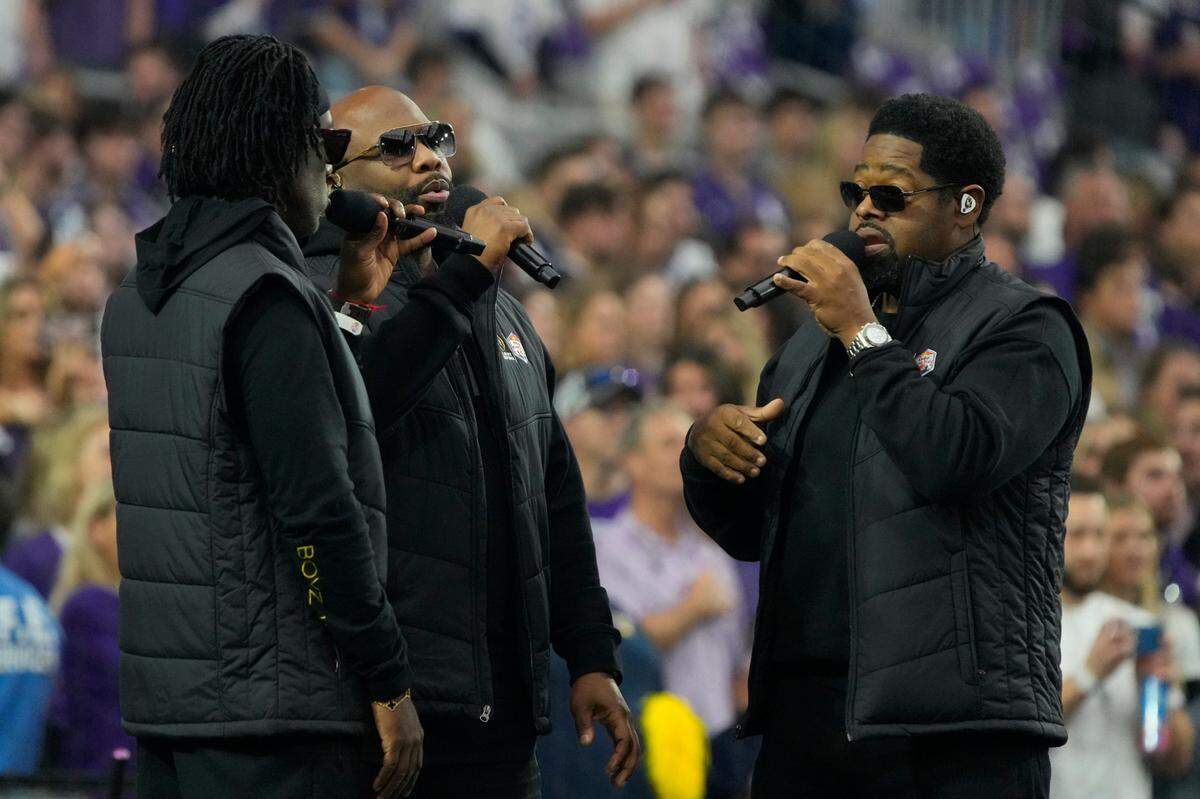 Boyz II Men sing the national anthem prior to the Fiesta Bowl NCAA college football semifinal playoff game between TCU and Michigan, Saturday, Dec. 31, 2022, in Glendale, Ariz. (AP Photo/Rick Scuteri)