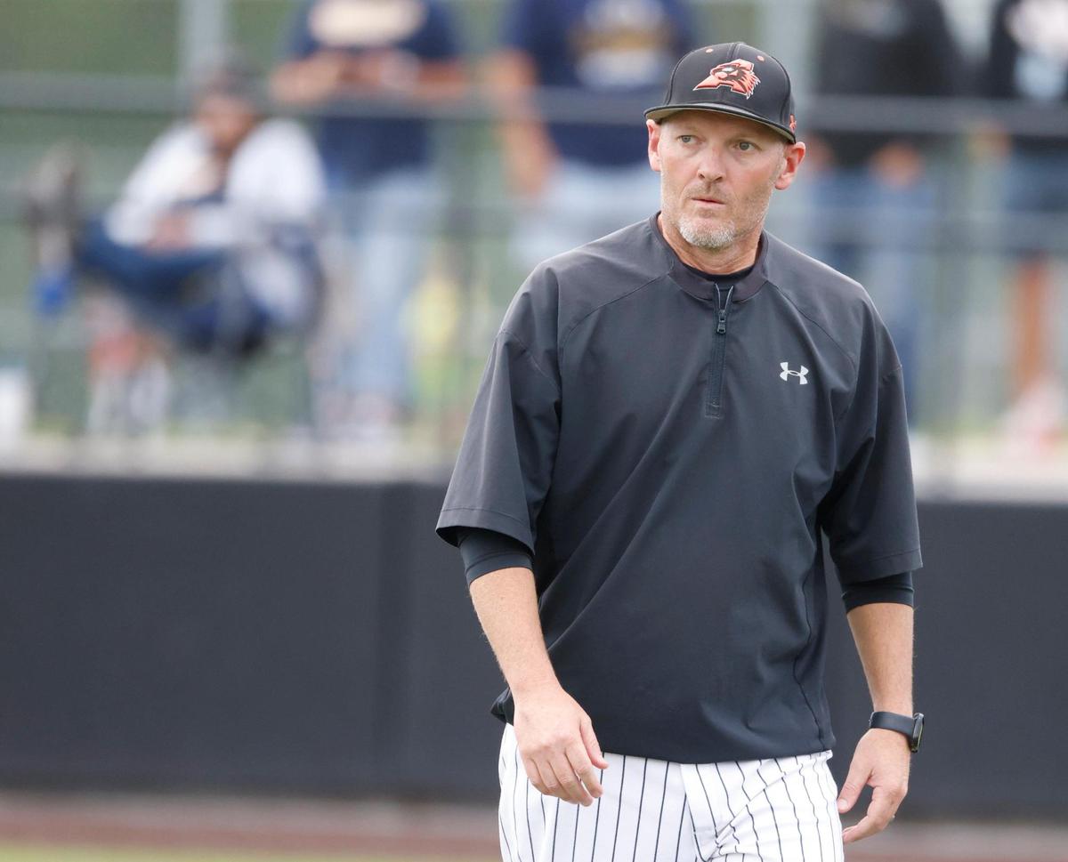 Aledo head coach Chad Barry walks back to the dugout to begin game one of a UIL Area Round 5AD1 baseball playoff game at Bearcat Field in Aledo, Texas, Thursday, May 08, 2025.