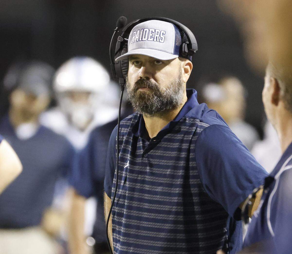 L.D. Bell head coach TJ Dibble glances down the sidelines with under three minutes left in the second half of a UIL football game between L.D. Bell and Timber Creek at Keller ISD Athletic Complex in Keller on Thursday, Sept. 11, 2025.