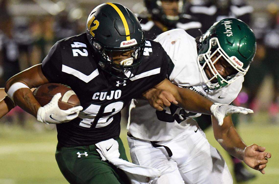 Western Hills’ Jason Green, left, collides with Kennedale’s Poasa Utu as he rushes out of the backfield in the second quarter of their District 6-4A Division 1 football game on Thursday, October 7, 2021 at Farrington Field in Fort Worth, Texas. Special/Bob Haynes