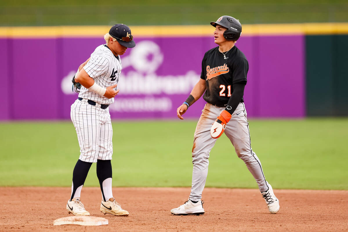 Aledo center fielder Luke Gladchuk (21) steps off second base after pushing the second baseman from Montgomery Lake Creek in the UIL Class 5A Division I baseball state championship game on Friday, June 5, 2026, at Dell Diamond in Round Rock, Texas.