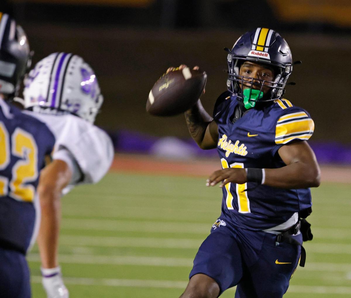Arlington Heights quarterback Kaeden Grant (11) tosses a short pass during the Battle of the Bonfire UIL District 4-5A D1 football game at Farrington Field in Fort Worth, Texas, Friday, Nov. 08, 2024.