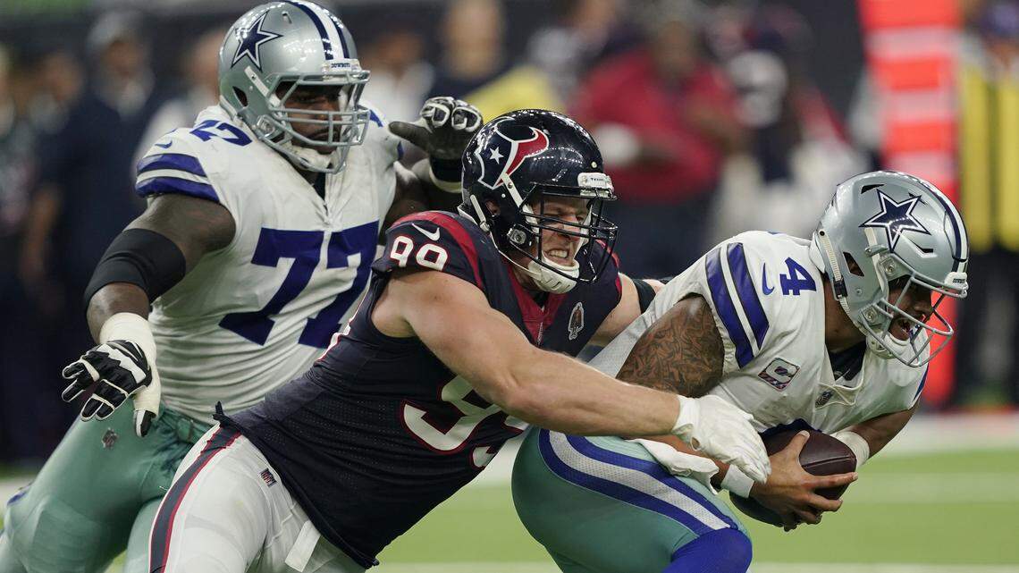 Houston Texans defensive end J.J. Watt sacks Dallas Cowboys quarterback Dak Prescott in the second half of the Cowboys’ 19-16 overtime loss in Houston.