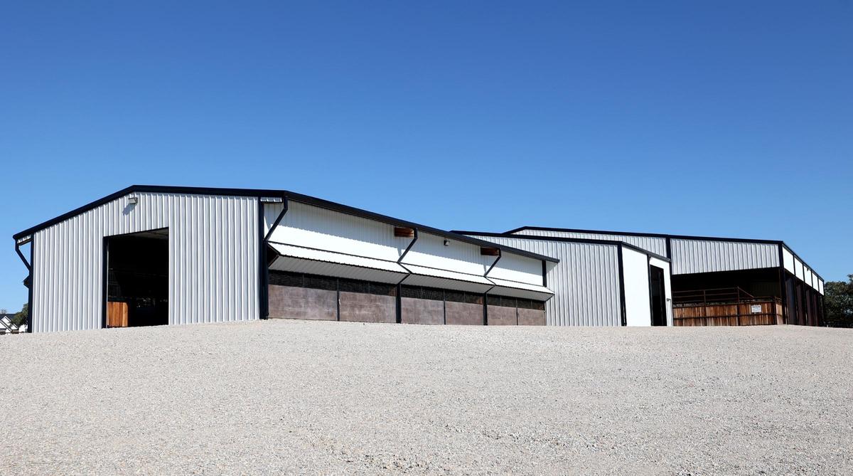 This Weatherford property features a barn with 12 stalls, as well as a covered arena with holding pens on each corner.