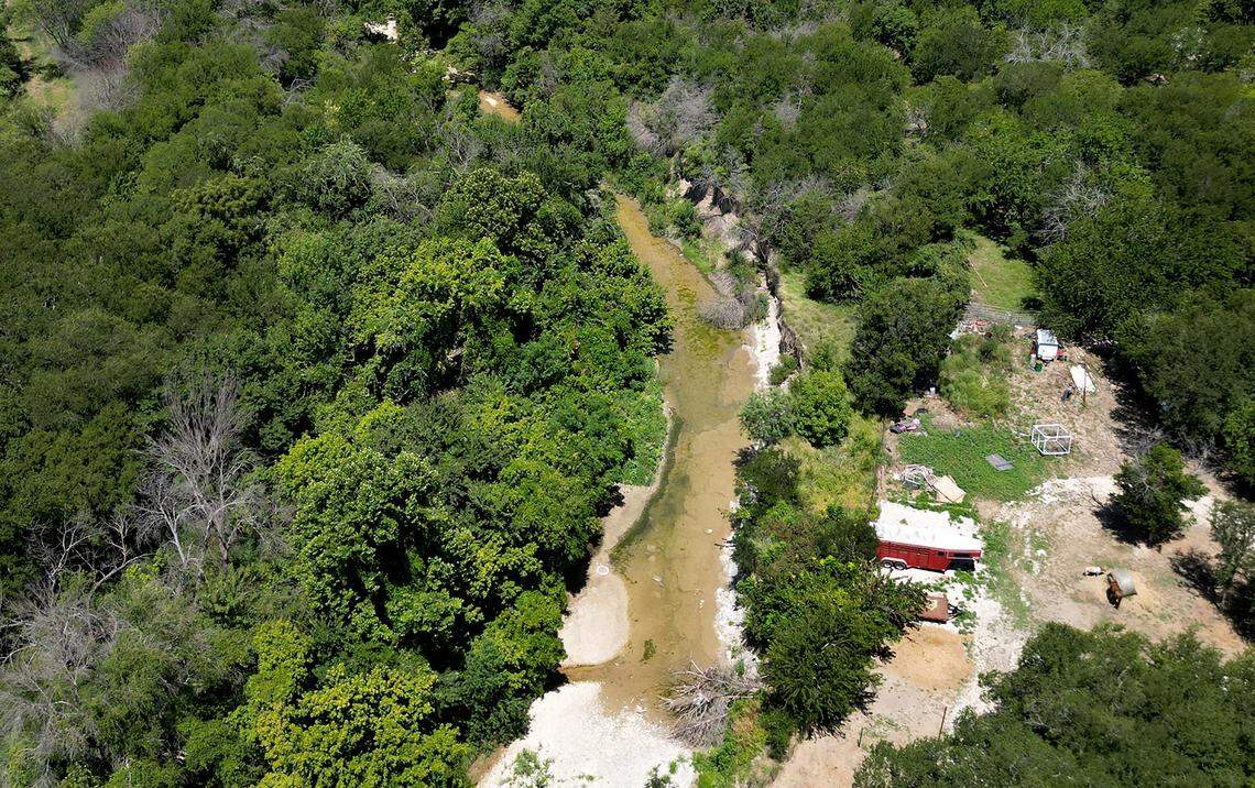 Mary's Creek, a tributary to the Clear Fork of the Trinity River, in Benbrook on Wednesday, July 30, 2025. Residents are concerned rezoning an 80-acre plot of land on the eastern edge of Mary's Creek for development could alter the floodplain and potentially cause seious flooding issues.