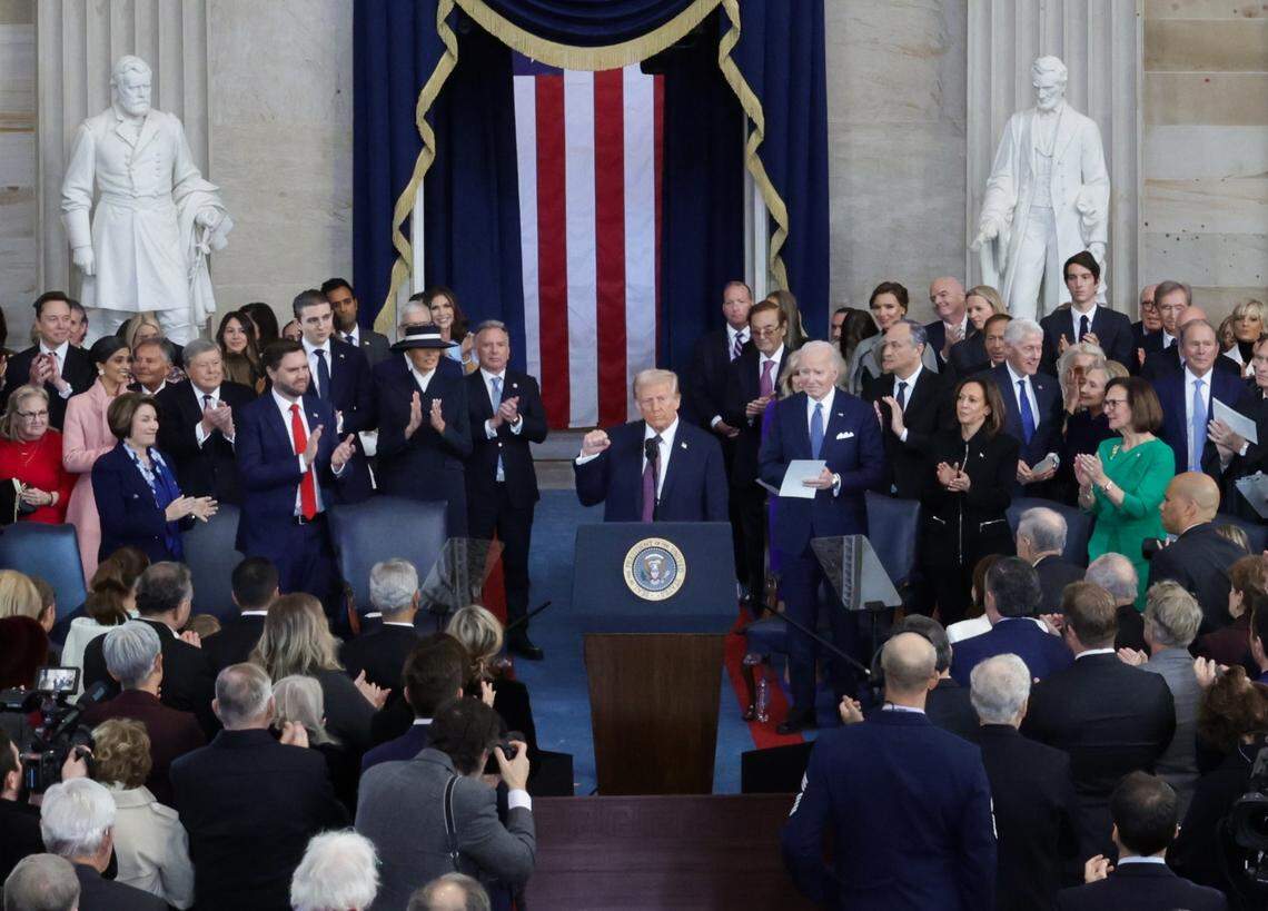 Jan 20, 2025; Washington, DC, USA; U.S. President Donald Trump raises his fist after taking the oath on the day of his Presidential Inauguration at the Rotunda of the U.S. Capitol in Washington, U.S. January 20, 2025. REUTERS/Fabrizio Bensch/Pool Mandatory Credit: Fabrizio Bensch-Pool via Imagn Images