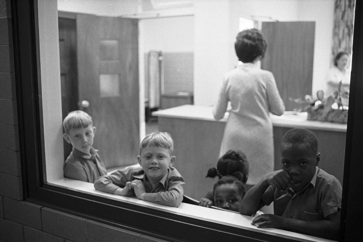 Aug. 30, 1971: These five second-graders were all smiles this morning as they waited in the office of Versia Williams Elementary for room assignments. Most of the children assigned to the Riverside cluster school were in their rooms without delay. The school’s principal, Clyde Johnson, said there were no more problems than on any other opening day.