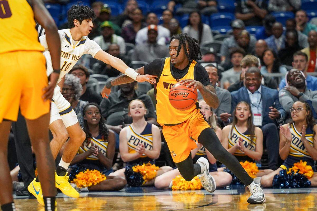 Beaumont United’s Daniel Williams (1) tries to drive to the bucket against Round Rock Stony Point’s Landon Short (10) in a Class 6A state semifinal on Friday, March 8, 2024 at the Alamodome in San Antonio, Texas. Stony Point downed United 54-46.