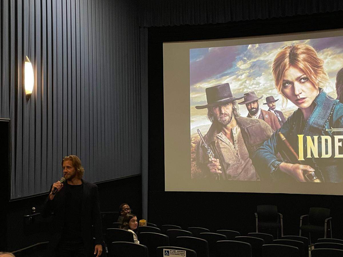 Dallas-native and actor Matt Barr welcomes the crowd to a screening of The CW show, “Walker: Independence”, at the Angelika Film Center in Dallas on Oct. 20, 2022.