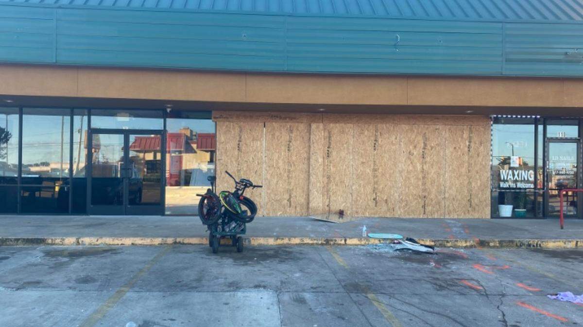 Windows are boarded up where witnesses told Fort Worth police a stolen black truck drove through the front of a game room Wednesday, Nov. 10, 2021, and then the vehicle drove back and forth multiple times inside of the building. A man was killed inside the business.