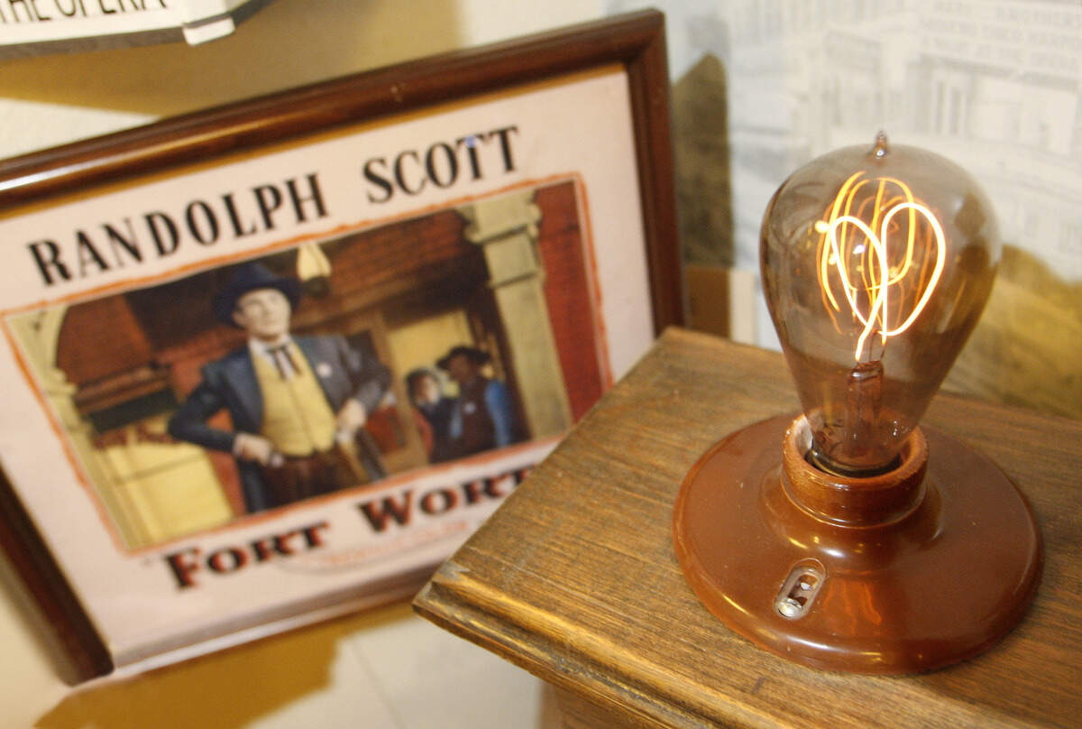 The 1908-vintage Palace Theater lightbulb burns in a display case in the Stockyards Museum.