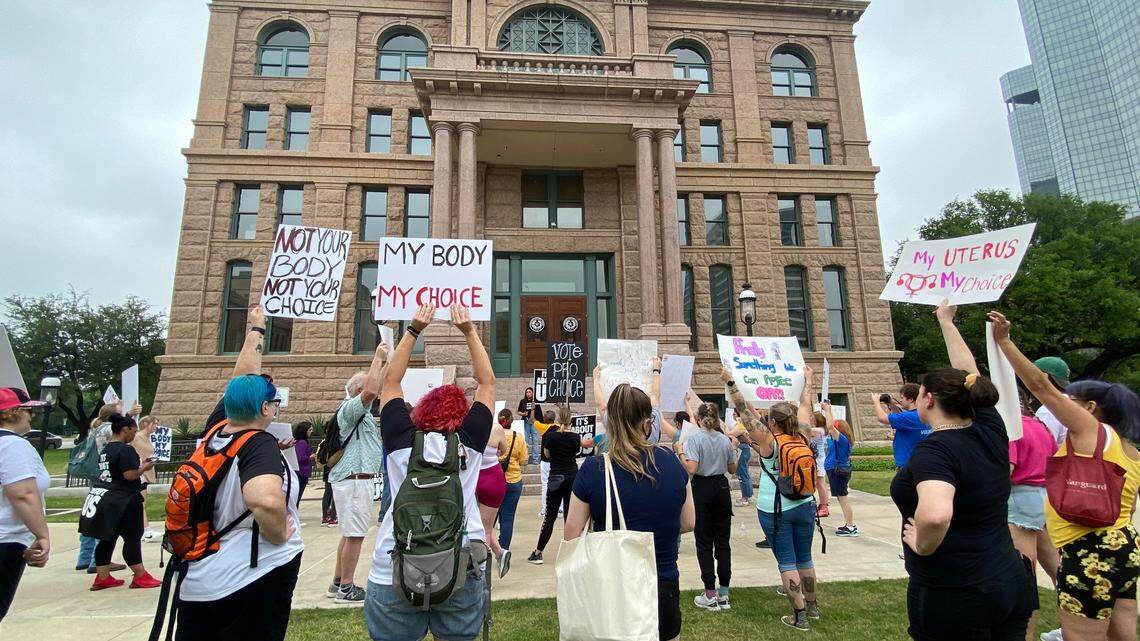 Dozens of abortion rights supporters gathered outside the Tarrant County Courthouse Saturday morning protesting against a leaked draft decision from the Supreme Court to overturn Roe v. Wade.