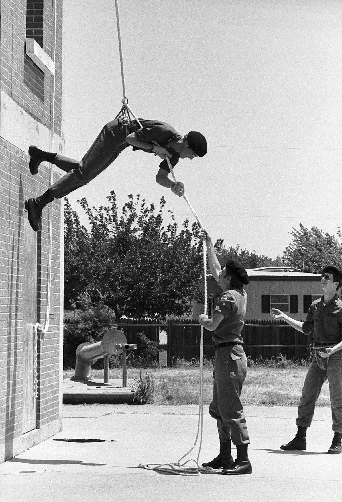 April 30, 1978: University of Texas at Arlington students had a chance to learn rappelling at the Arlington fire training center. About 35 students, with the aid of 15 ROTC members, learned the technique for descending from a height through the use of a rope system. The 15 ROTC members are part of the Army ROTC Insurgent Team at UTA.