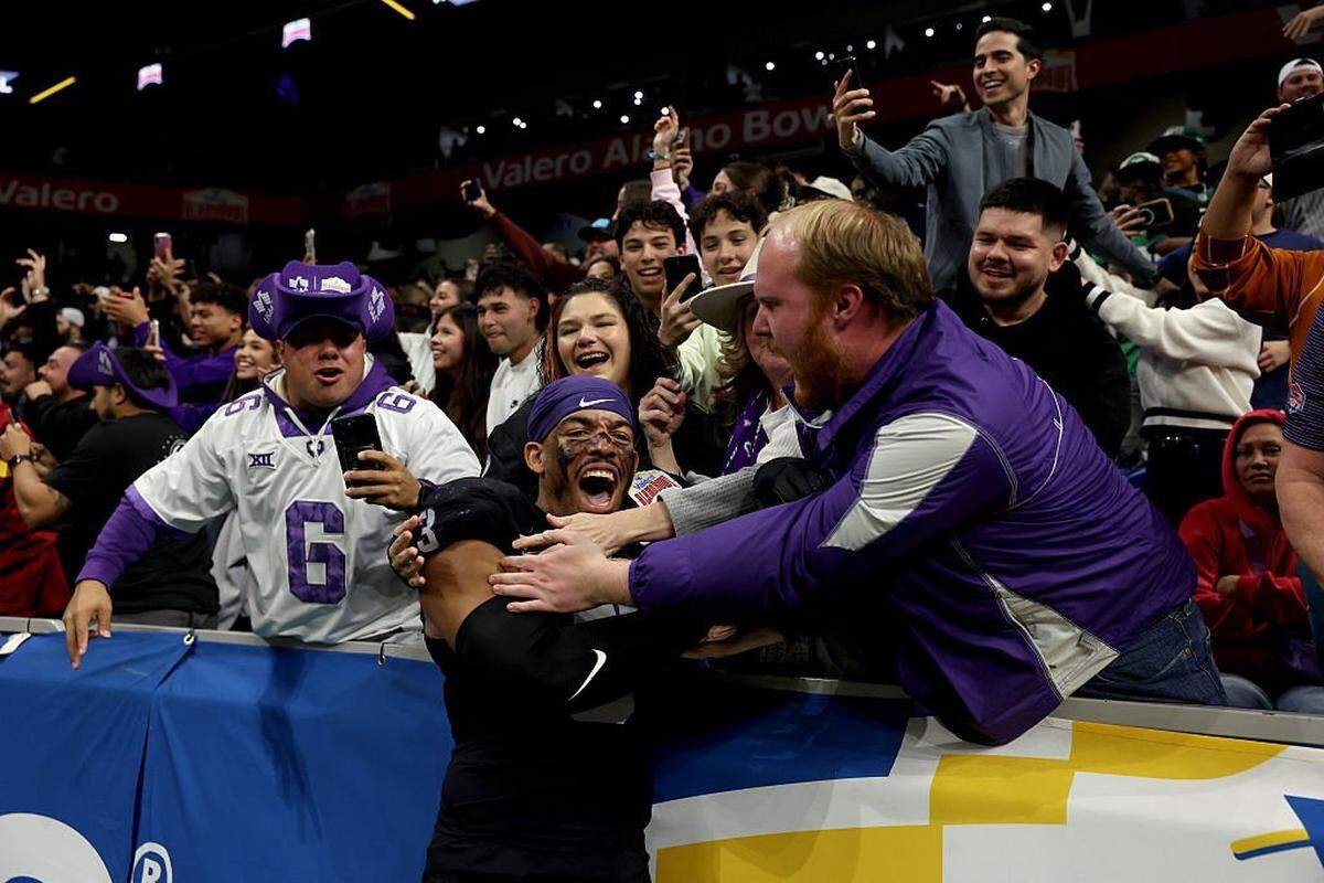 SAN ANTONIO, TEXAS - DECEMBER 30: Kaleb Elarms-Orr #3 of the TCU Horned Frogs celebrates with fans after the final play of the game against the USC Trojans at Alamodome on December 30, 2025 in San Antonio, Texas. (Photo by Kenneth Richmond/Getty Images)