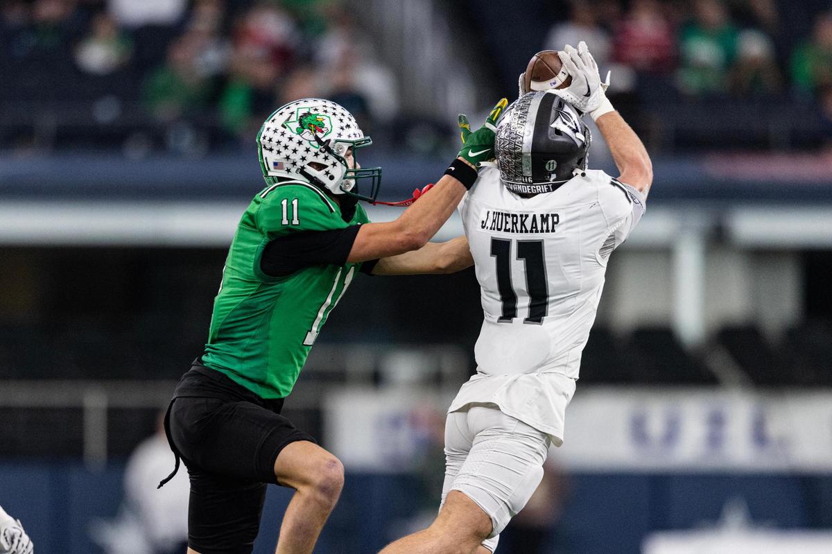 Vandegrift defensive back Jack Huerkamp (11) intercepts a pass from Southlake Carroll quarterback Angelo Renda (2) intended for wide receiver Brock Boyd (11) in the first half of the UIL 6A Division II championship game at AT&T Stadium in Arlington on Saturday, Dec. 21, 2024.