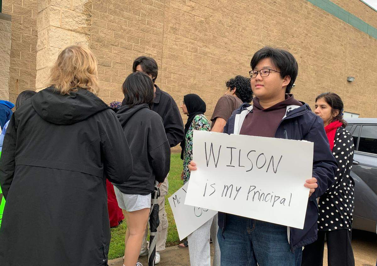 Hundreds of students, parents and district employees raised signs protesting the non-renewal of Southlake Carroll Senior High Principal Ryan Wilson’s contract on May 5, 2025.
