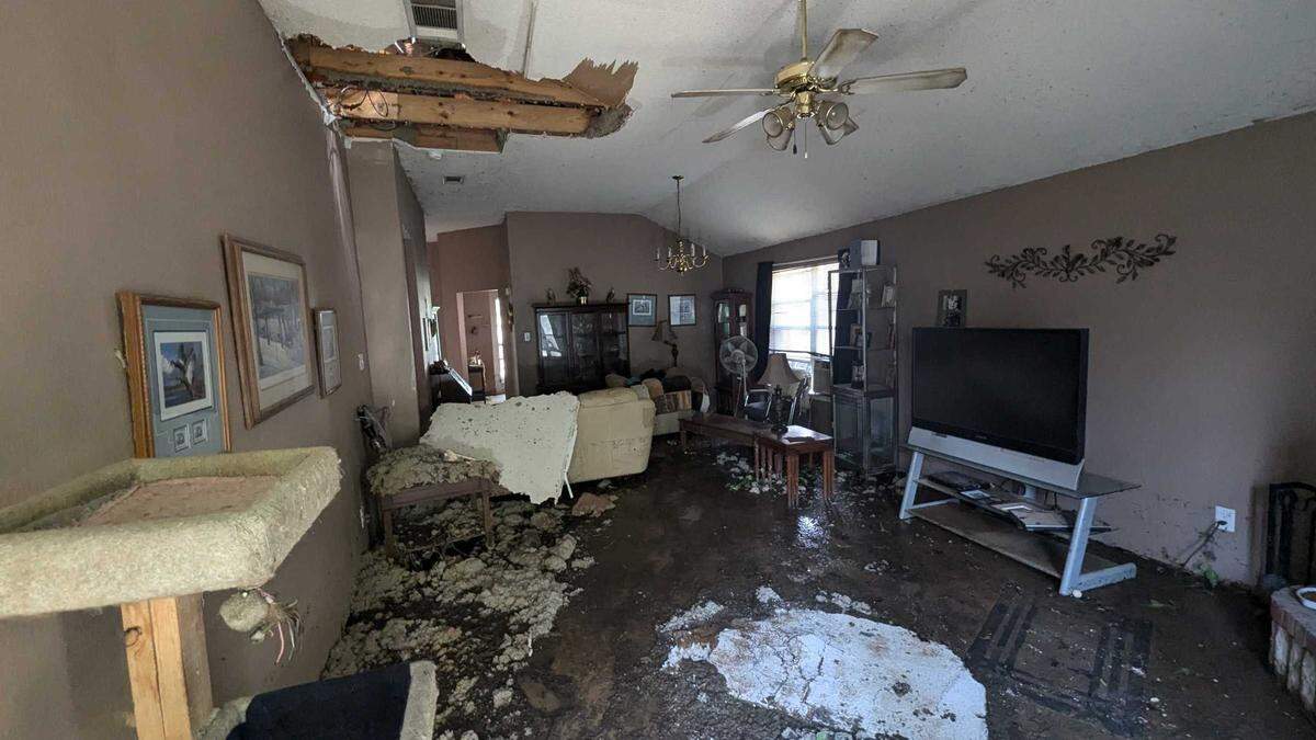 Susie Clark, who has lived at 8604 Trinity Vista Trail for 23 years, showed the Star-Telegram the damage to her living room. Clark said she came home to a “Yellowstone geyser” shooting onto her house on Monday, Aug. 26, 2024.
