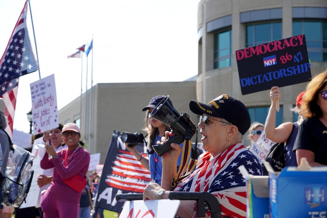 Protesters gather for the “No Kings Day” protest on June 14, 2025 in Arlington.