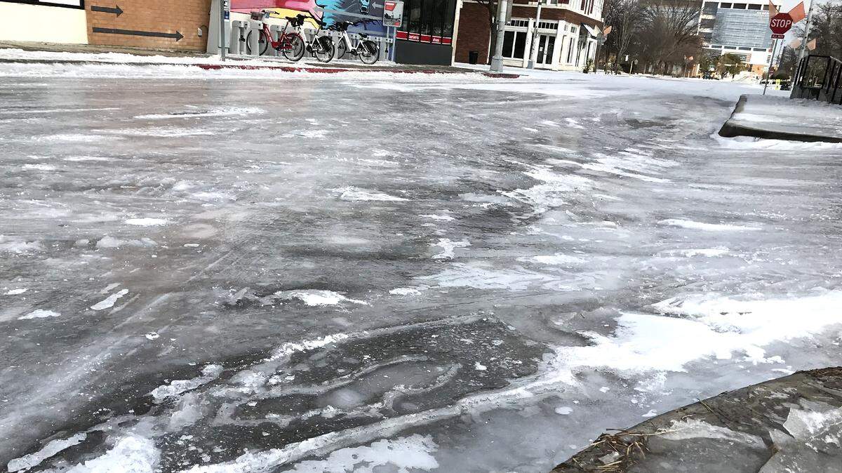 A sheet of ice covers Henderson Street near the intersection with Magnolia Avenue on Friday, February 3, 2022. Icy roads began thawing Saturday.
