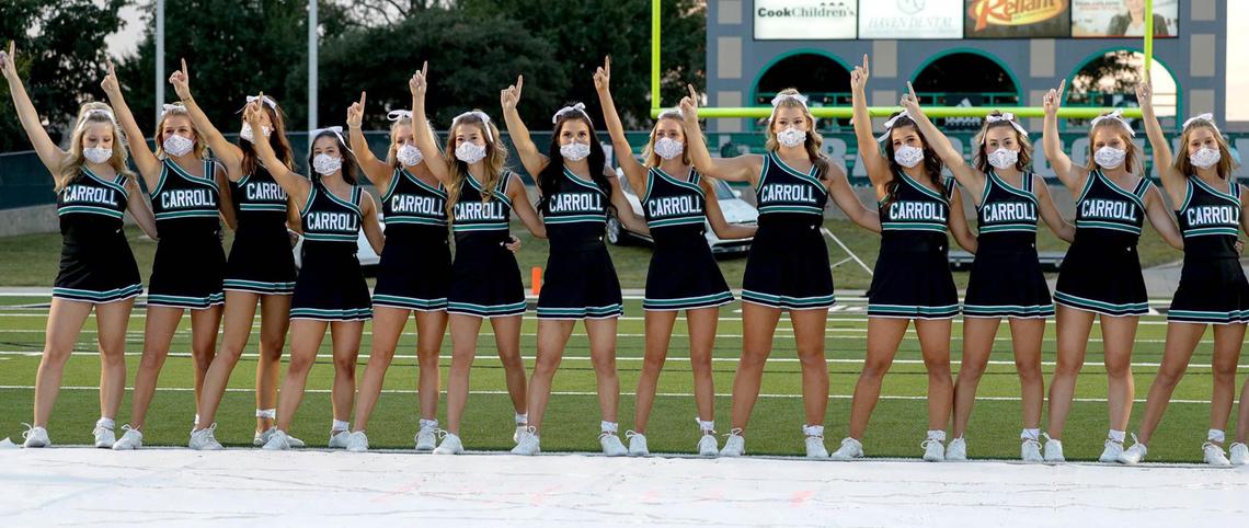 The Southake Carroll cheerleaders get ready for the game against Rockwall Heath, Friday night, October 2, 2020 played at Dragon Stadium in Southlake, TX. (Steve Nurenberg Special to the Star-Telgram)