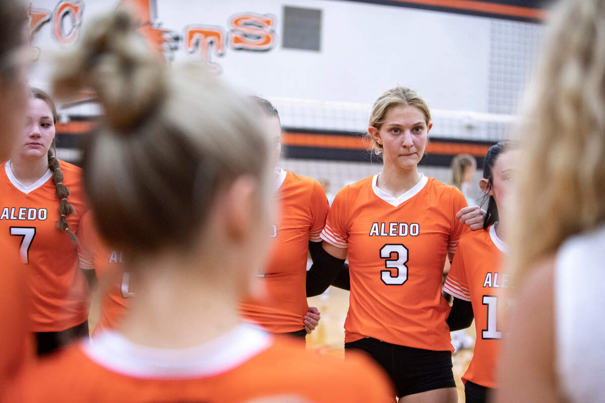Junior Vivian Parker joins the huddle during a volleyball game at Aledo High School on Tuesday, August 9, 2022, in Aledo, Texas.
