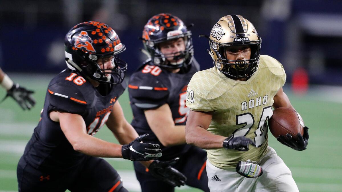 Aledo linebackers Weston Reese (16) and Tatum Price (50) chase Wichita Falls Rider running back Tre Byrd (20) to the end zone for Rider’s only score of the game in the second half of a high school Class 5A Division II State Semifinals football playoff game at AT&T Stadium, Arlington, Texas, Friday, Dec. 14, 2018. Aledo won the game 63-7. (Star-Telegram Bob Booth)