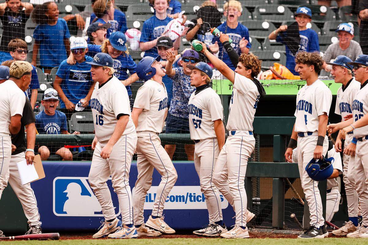 Robinson players celebrate after scoring two runs against Brock in the UIL Class 4A Division II baseball state championship game on Friday, June 5, 2026, at Dell Diamond in Round Rock, Texas.