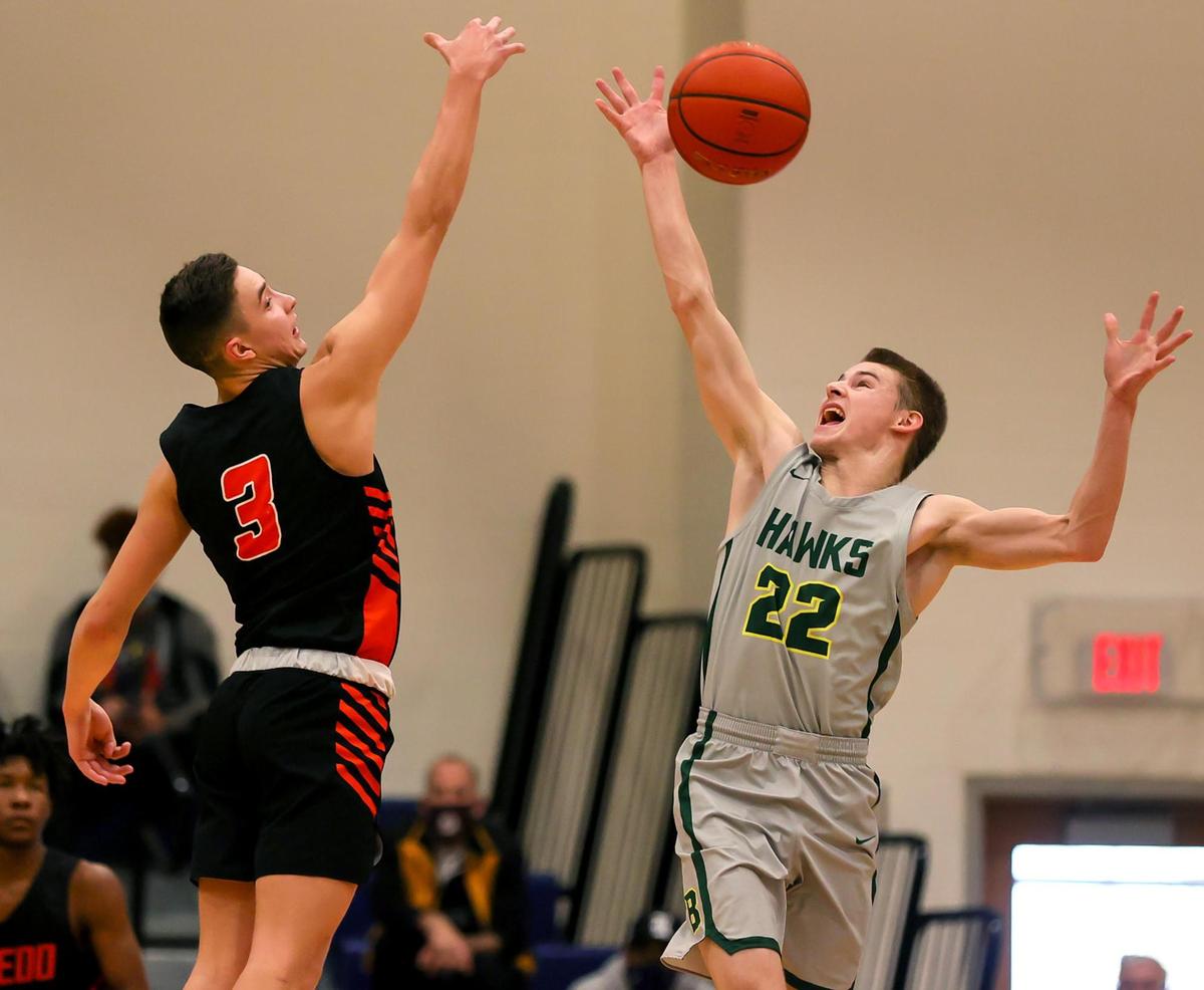 Birdville guard Chase Henderson (22) goes for a loose ball against Aledo guard Landry Simmons (3) during the second half of a 5A Bi-district Boys High School Basketball game played at Richland High School, February 20, 2021 in North Richland Hills, Tx. (Steve Nurenberg Special to the Star-Telegram)