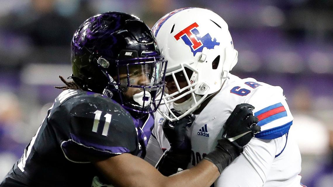 TCU defensive end Khari Coleman, left, had a standout freshman season in 2020 but has been sidelined so far this season.