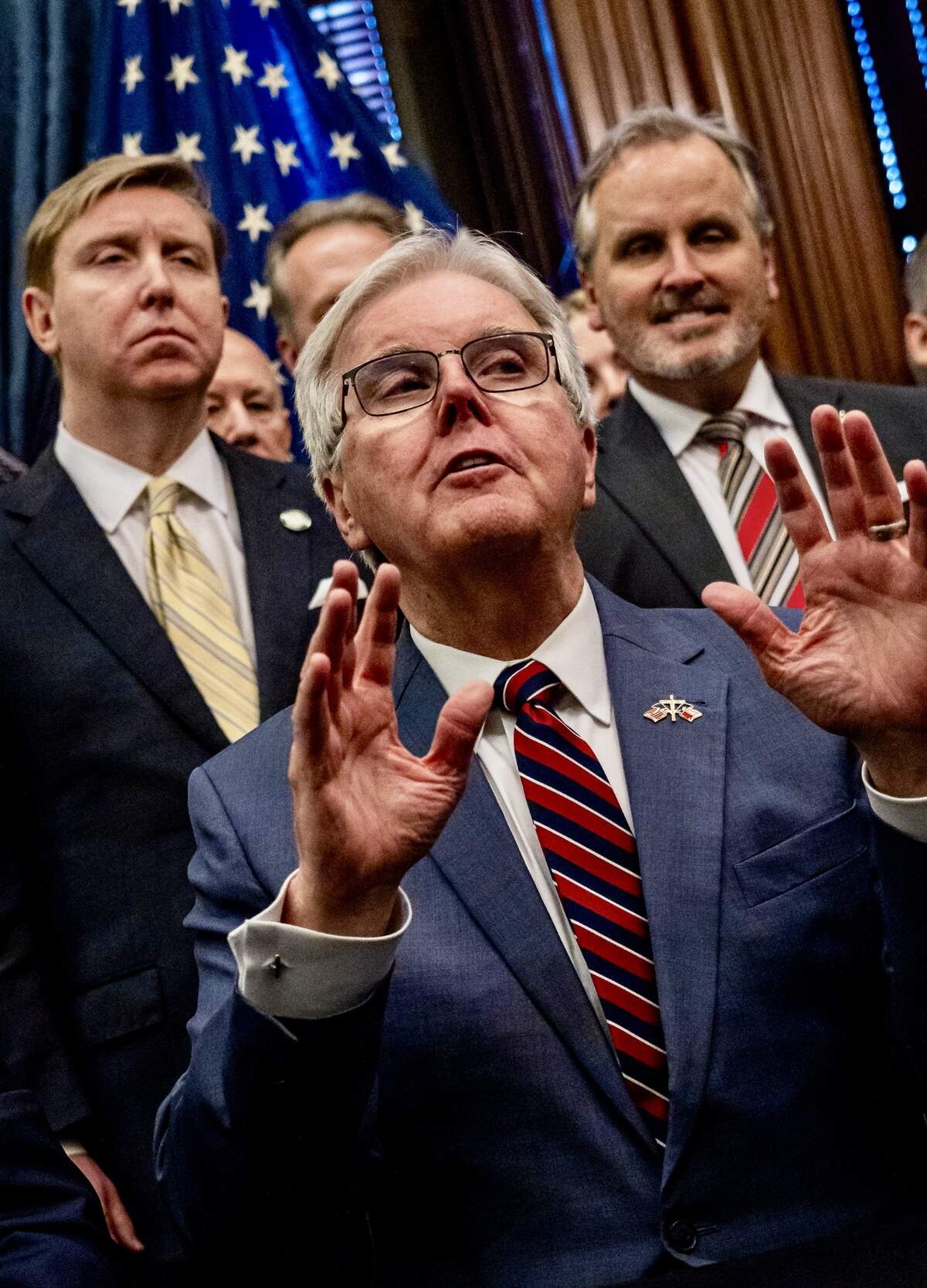 Texas Lieutenant Governor Dan Patrick speaks about the growth of business in Texas ahead of the Governor’s signing of three business-friendly bills at the Texas State Capitol, May 14, 2025. Sens. Tan Parker, left, and Bryan Hughes are behind him.
