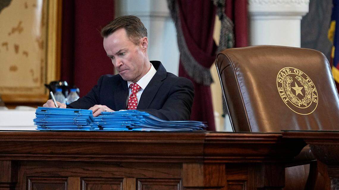 Texas Speaker of the House Dade Phelan signs bills in the House Chamber at the Texas Capitol on the last day of the legislative session on Monday.