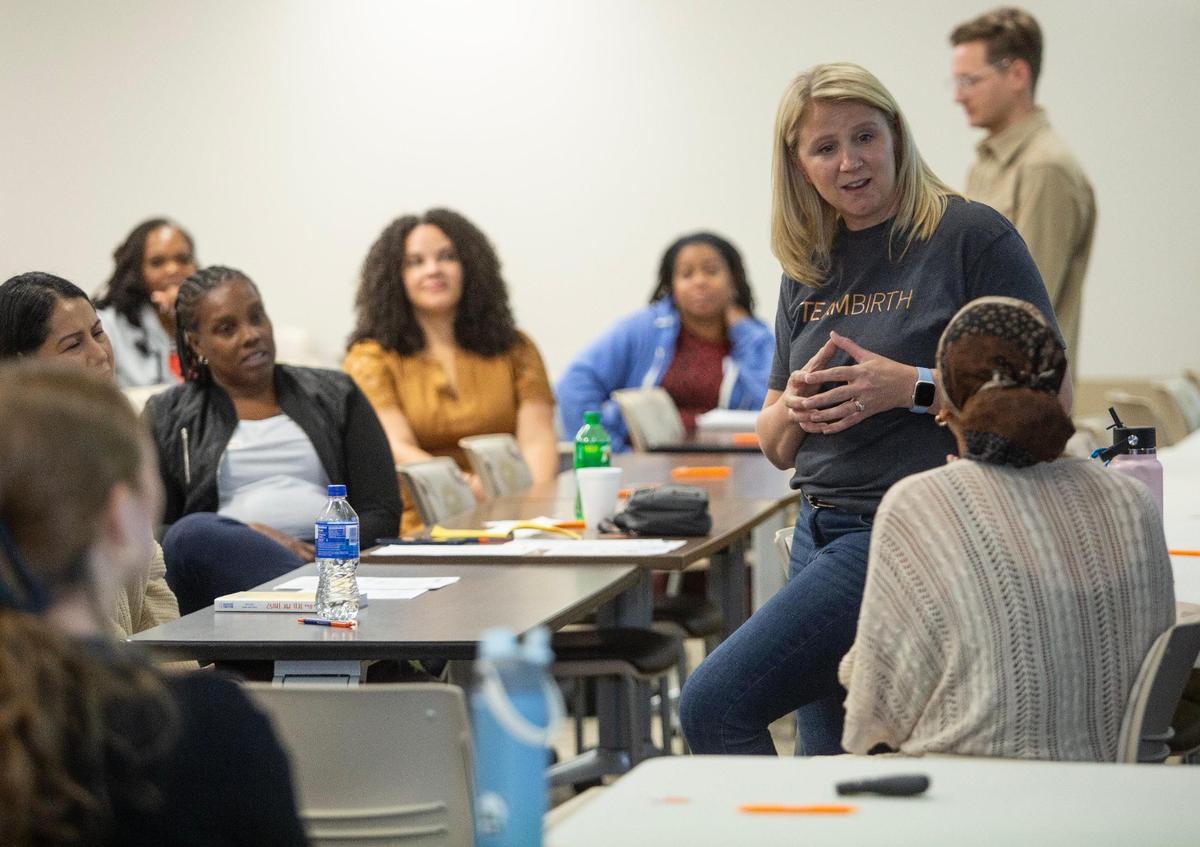 Trisha Short, senior clinical implementation specialist, speaks to doulas during a huddle simulation session at THR Harris Methodist Fort Worth in October 2024. The huddle system is used to keep pregnant women informed and involved in their medical care.