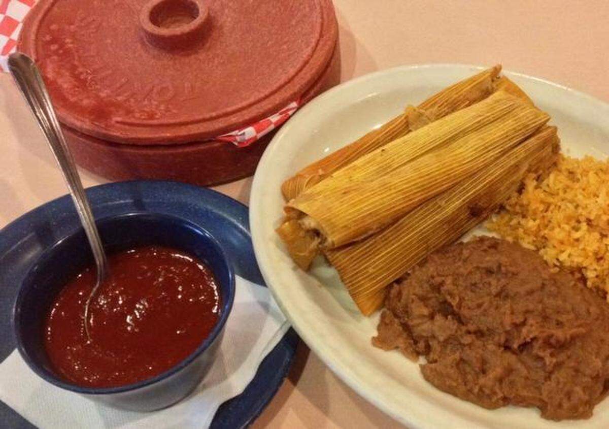 The pork tamale plate at Esperanza’s Restaurant & Bakery with chili sauce.