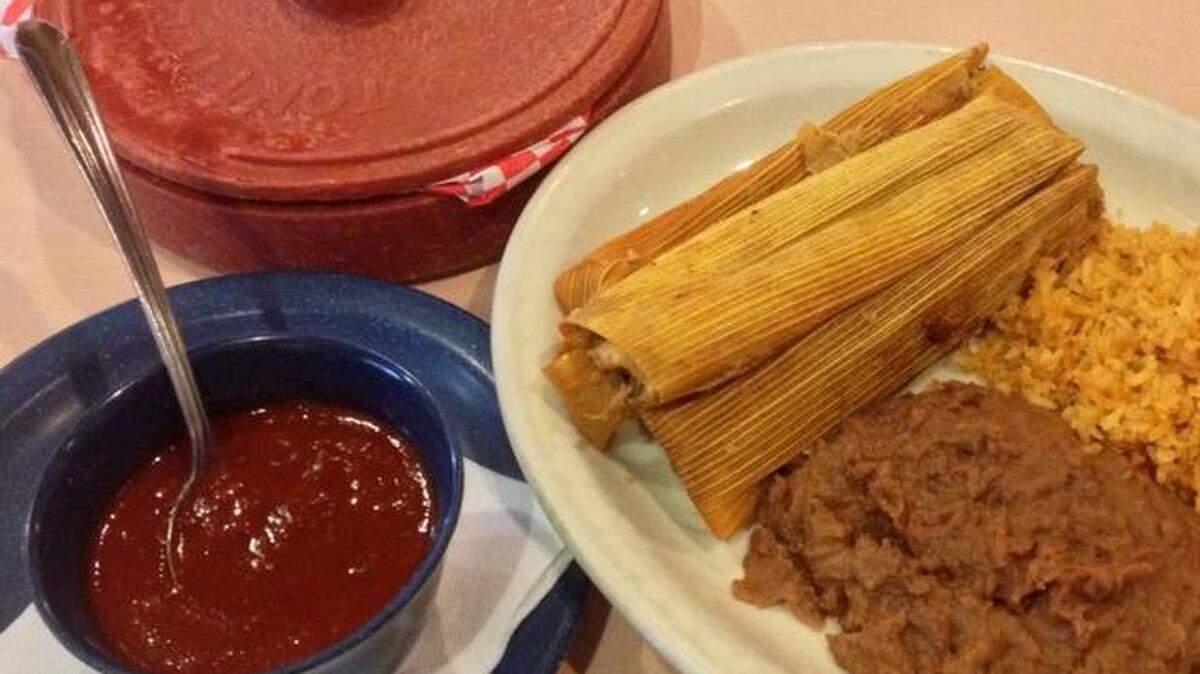 The pork tamale plate at Esperanza’s Restaurant & Bakery with chili sauce.