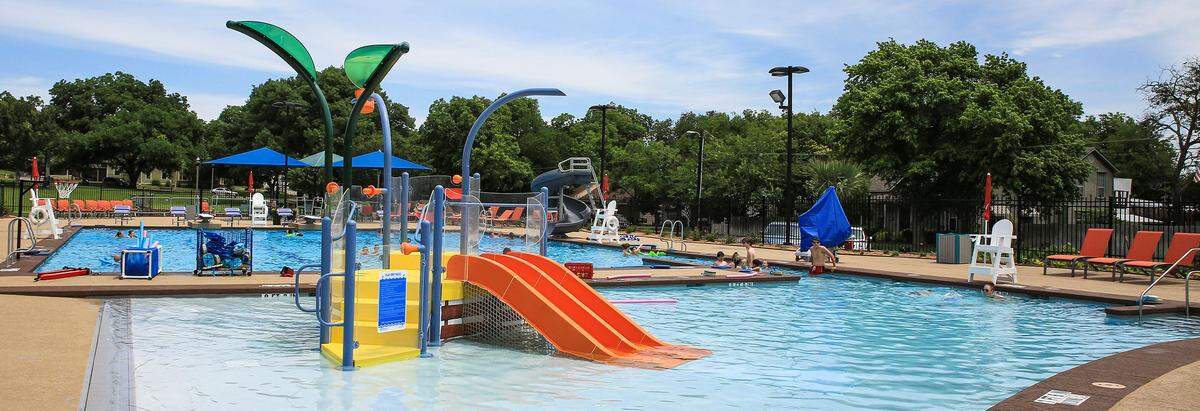 Cherry Park Pool featuring a splash pad