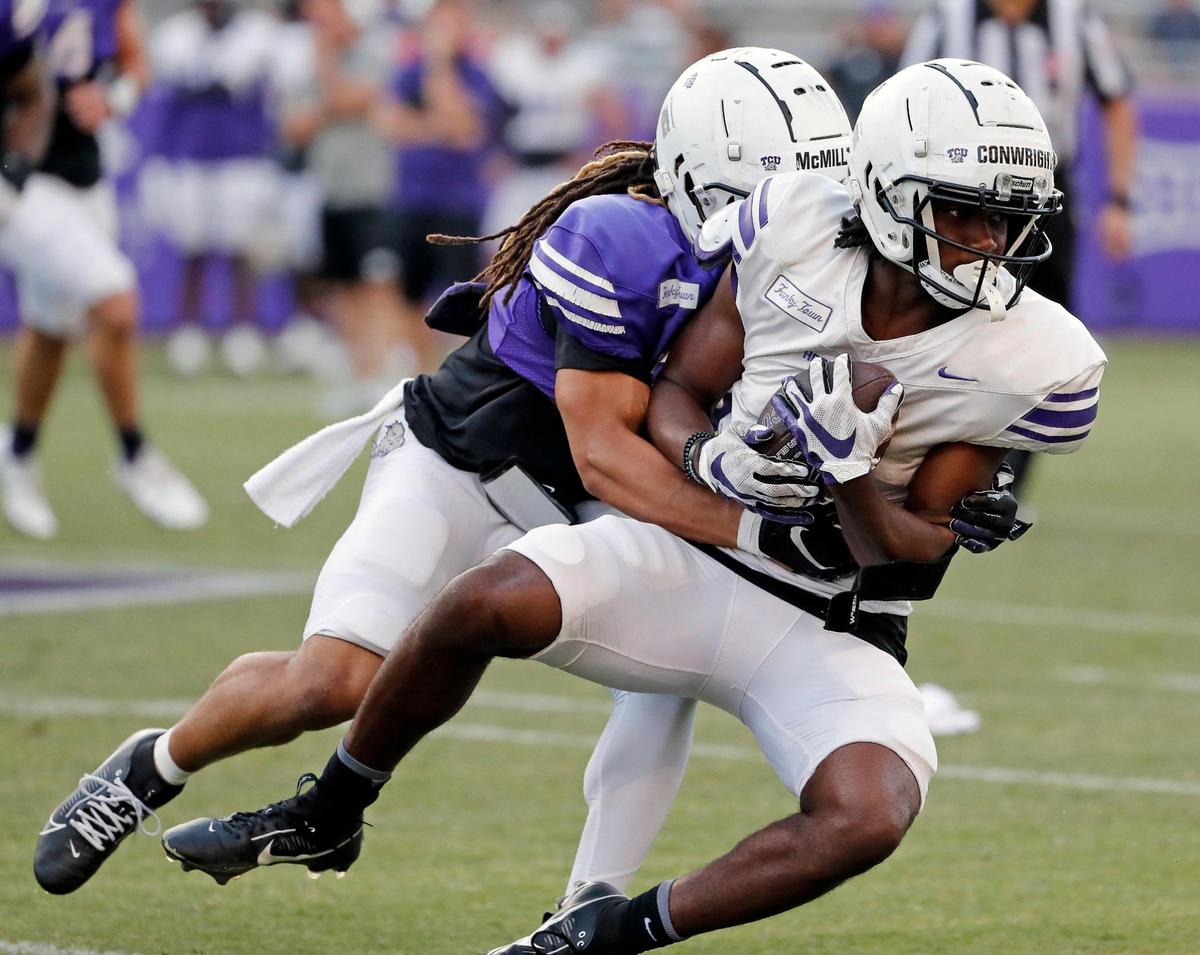 TCU cornerback Jaionte McMillan (27) tackles wide receiver Blair Conwright (0) during the TCU Spring Game at Amon G. Carter Stadium in Fort Worth, Texas, Friday, Apr. 14, 2023. (Special to the Star-Telegram Bob Booth)