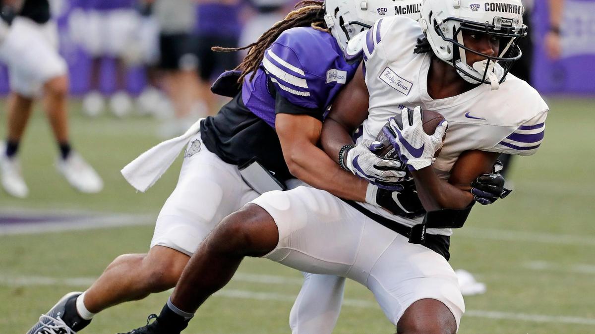 TCU cornerback Jaionte McMillan (27) tackles wide receiver Blair Conwright (0) during the TCU Spring Game at Amon G. Carter Stadium in Fort Worth, Texas, Friday, Apr. 14, 2023. Conwright entered the transfer portal the next day. (Special to the Star-Telegram Bob Booth)