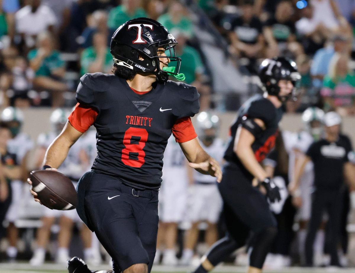 Trinity quarterback TJ Tupou (8) looks for a receiver in the second quarter during a UIL 6A Conference football game at Pennington Field in Bedford Texas, Friday, Sept. 20, 2024.
