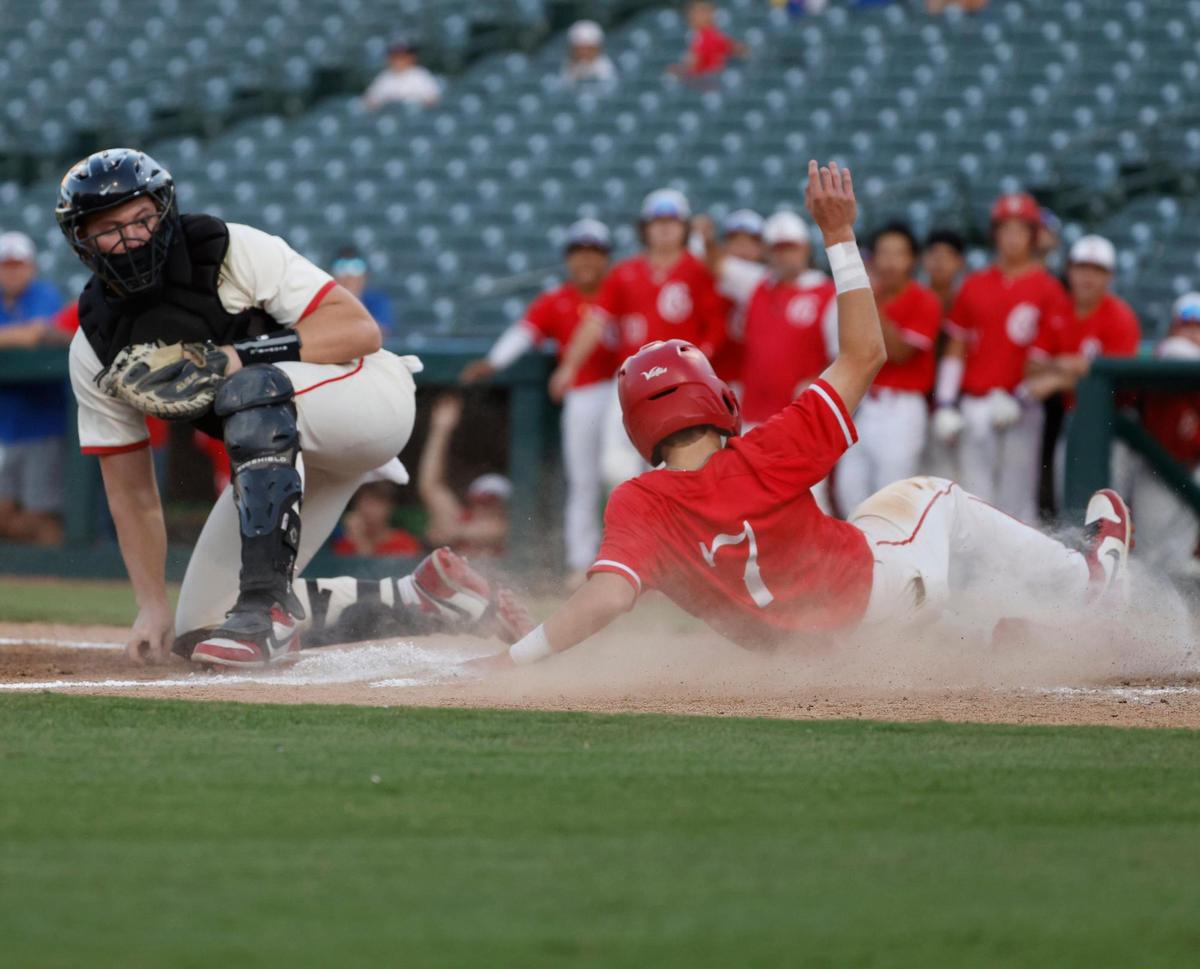 Lucas Lovejoy catcher Reese Ogden (12) watches as Grapevine short stop Connor Ray (7) slides by to score during a UIL 5A D2 semifinal baseball game at Riders Park in Frisco, Texas, Friday, May 30, 2025.