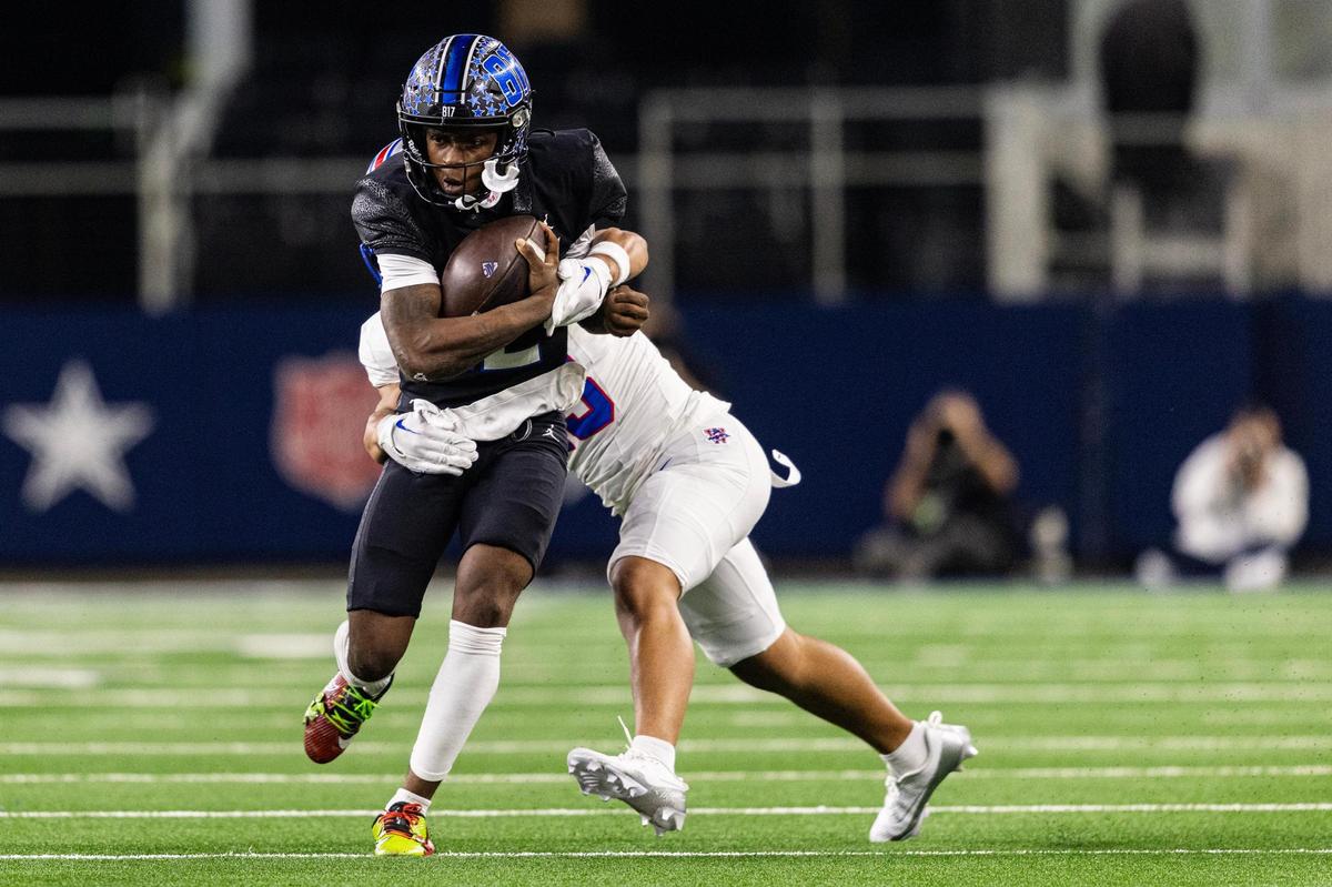 North Crowley quarterback Chris Jimerson (12) is tackled by Westlake cornerback George Jones III (23) in the first half of the UIL 6A Division I championship game at AT&T Stadium in Arlington on Saturday, Dec. 21, 2024.