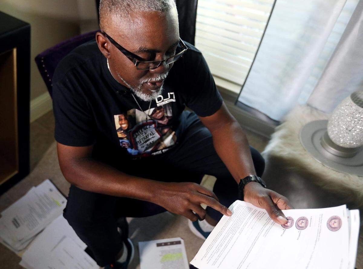 Kevin Tarver goes through documents he’s collected throughout his mission of seeking justice for his son, Darius Tarver. Darius Tarver was shot and killed by police after responding to a 911 call made by his roommate saying he was behaving strangely and barricaded himself in the apartment. Kevin Tarver says his son was experiencing a mental health issue at the time caused by head trauma from a recent accident.