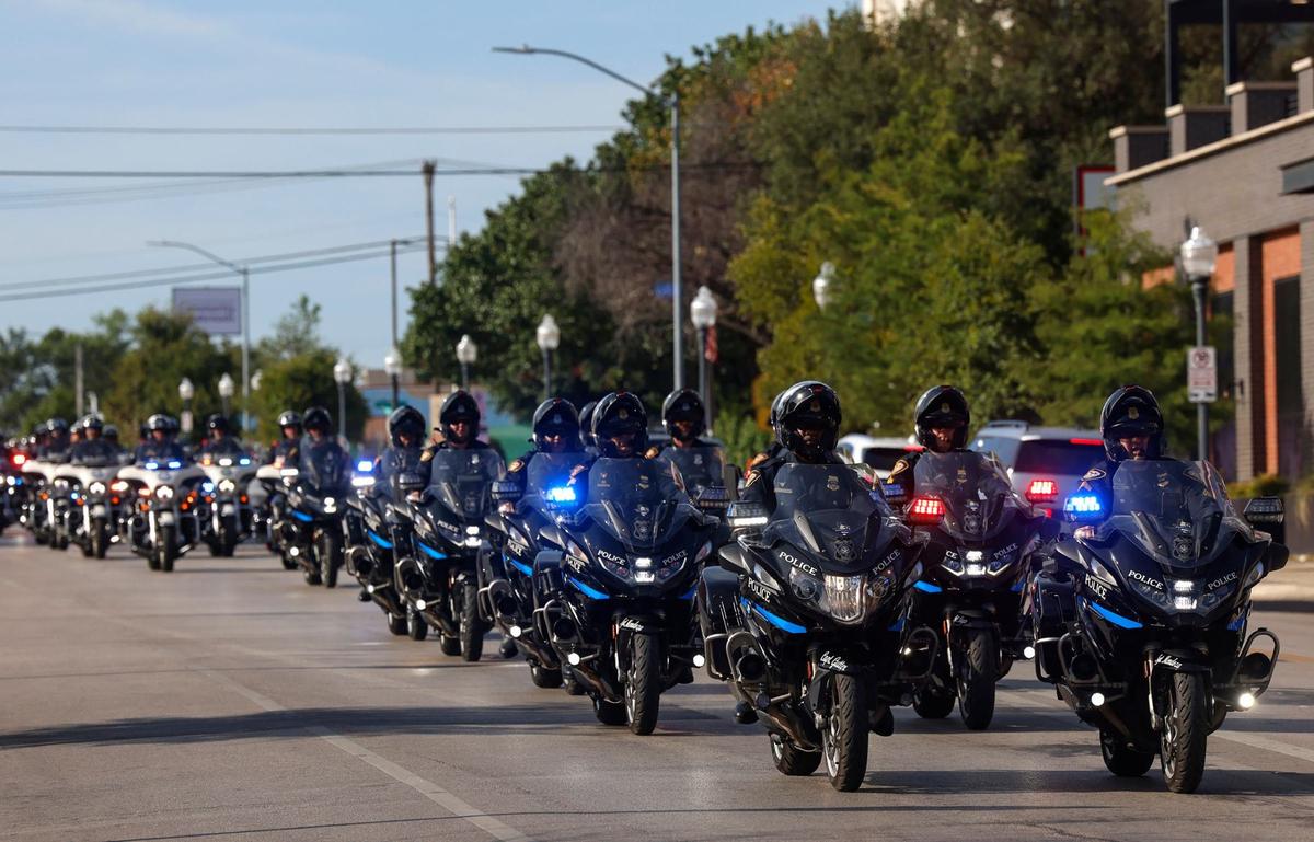 Law enforcement agencies from around North Texas participate in a procession from Bob Bolen Public Safety Complex to Christ Chapel Bible Church for the funeral of fallen Fort Worth police officer Sgt. Billy Randolph on Saturday.