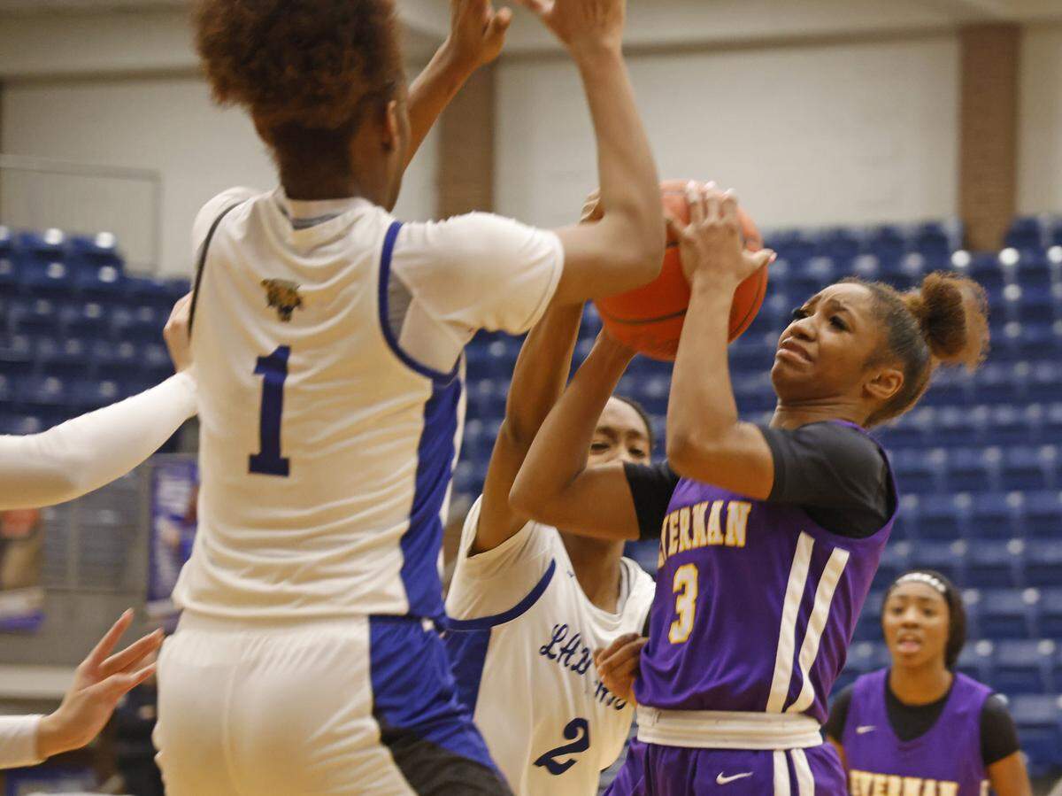 Everman point guard Harli Clark (3) has the ball stolen by Mansfield Summit shooting guard Aryn Williamson (2) during the first half of a UIL girls basketball game between Everman and Mansfield Summit at Summit High School in Mansfield, Texas, Thursday Jan. 22, 2026