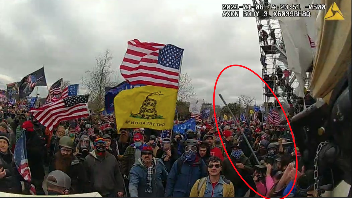 Lucas Denney, 44, of Mansfield, is accused of physically attacking U.S. Capitol Police officers on Jan 6, 2021. According to court documents, he is shown in this photo swinging a metal pole at law enforcement.