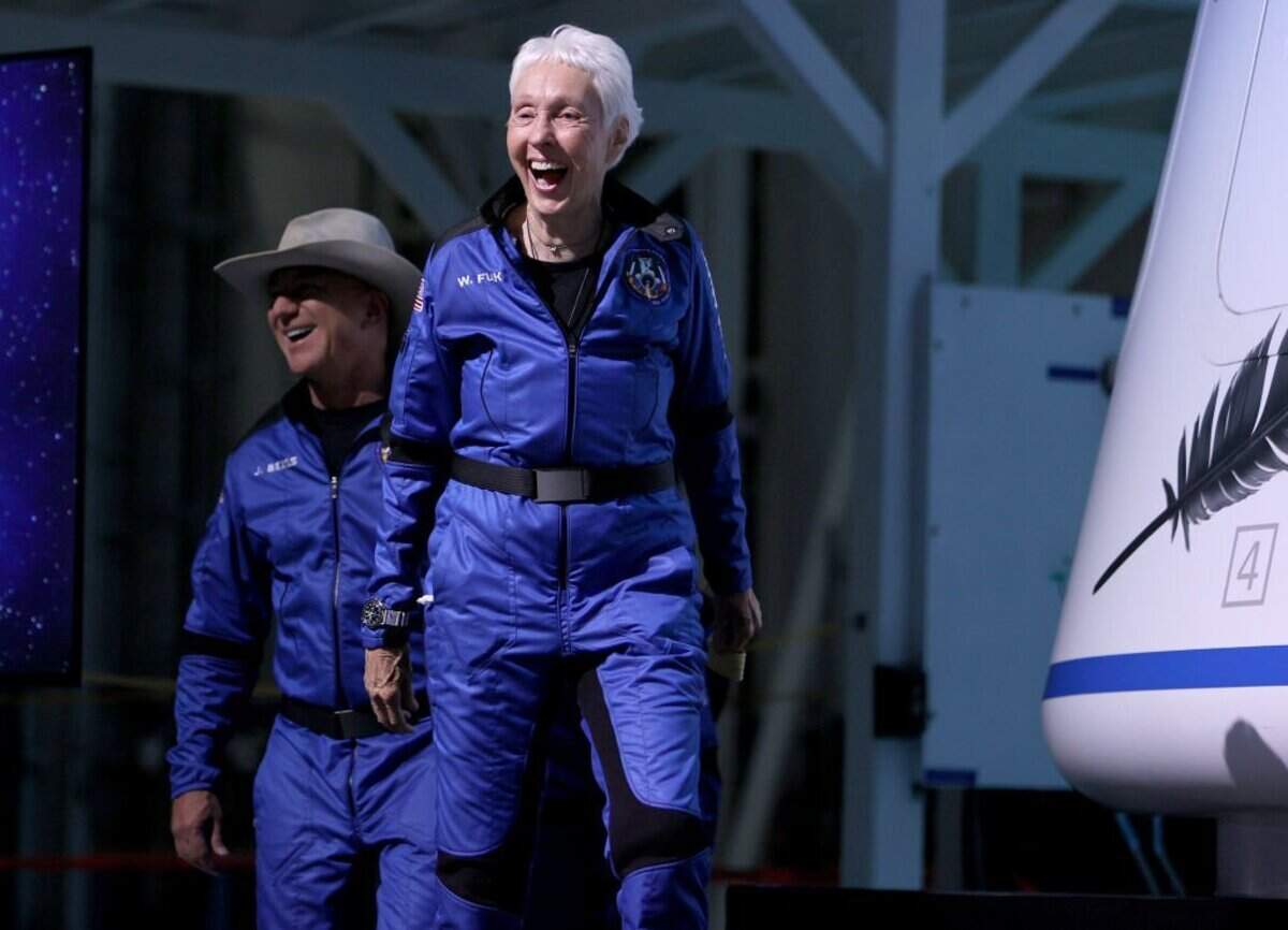 VAN HORN, TEXAS - JULY 20: Blue Origin's New Shepard crew (L-R) Jeff Bezos and Wally Funk arrive for a press conference after flying into space in the Blue Origin New Shepard rocket on July 20, 2021, in Van Horn, Texas. Mr. Bezos and the crew were the first human spaceflight for the company. (Photo by Joe Raedle/Getty Images)