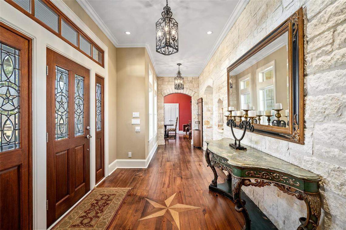 The estate spans 5,694 square feet with four bedrooms and six bathrooms.