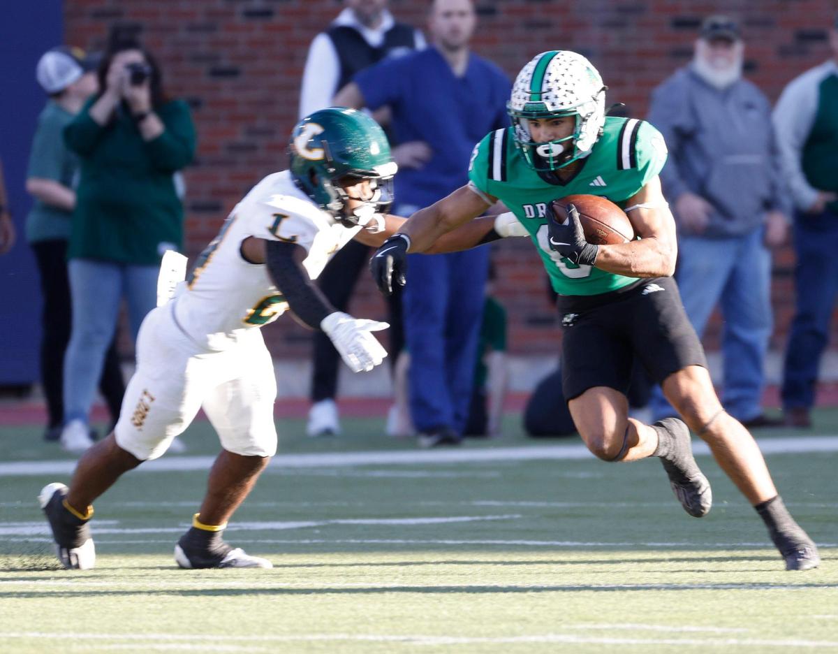 Southlake Carroll running back Christian Glenn (83) escapes the tackle of Longview’s Javarion Pereira (22) during the UIL 6A D2 Semifinals football game at Gerald J. Ford Stadium in University Park, Texas, Saturday, Dec. 14, 2024.