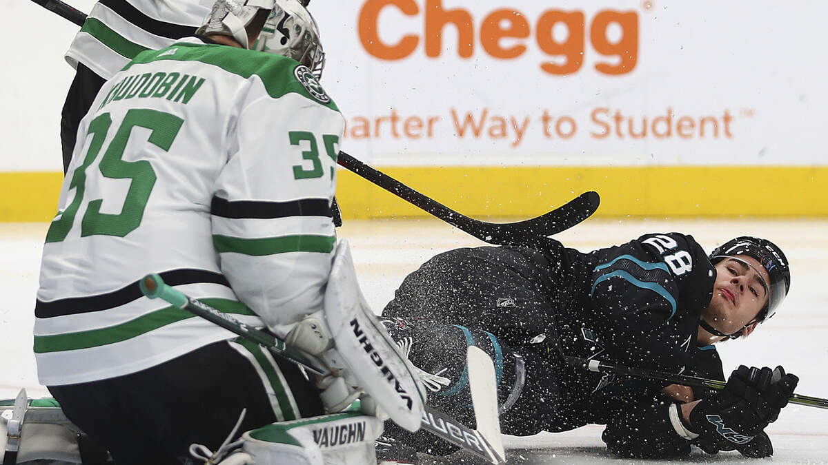 Dallas Stars goalie Anton Khudobin, left, makes a save in front of San Jose Sharks’ Timo Meier (28) in the first period of an NHL hockey game Thursday, Dec. 13, 2018, in San Jose, Calif. (AP Photo/Ben Margot)