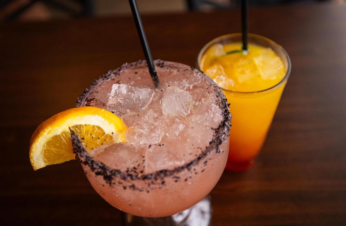 A Malibu Paloma, left, and Everest tequila sunrise are two drinks that fuse Indian spices into traditional cocktails at Palate Garden in Saginaw.